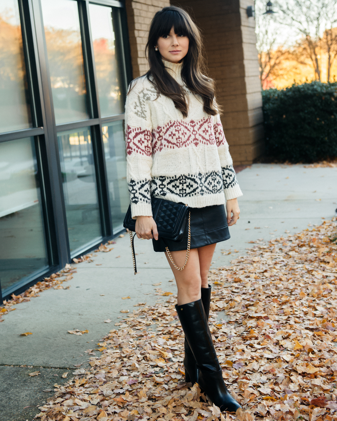 chunky sweater with leather accessories and skirt 