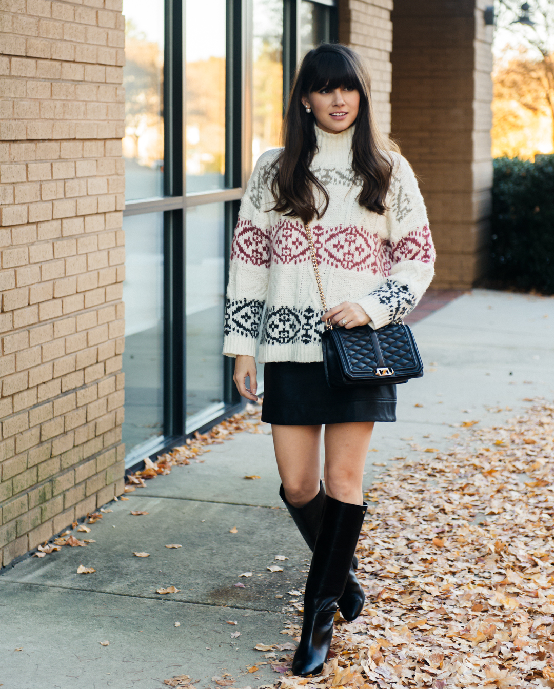 strolling through the park in a chunky holiday sweater 