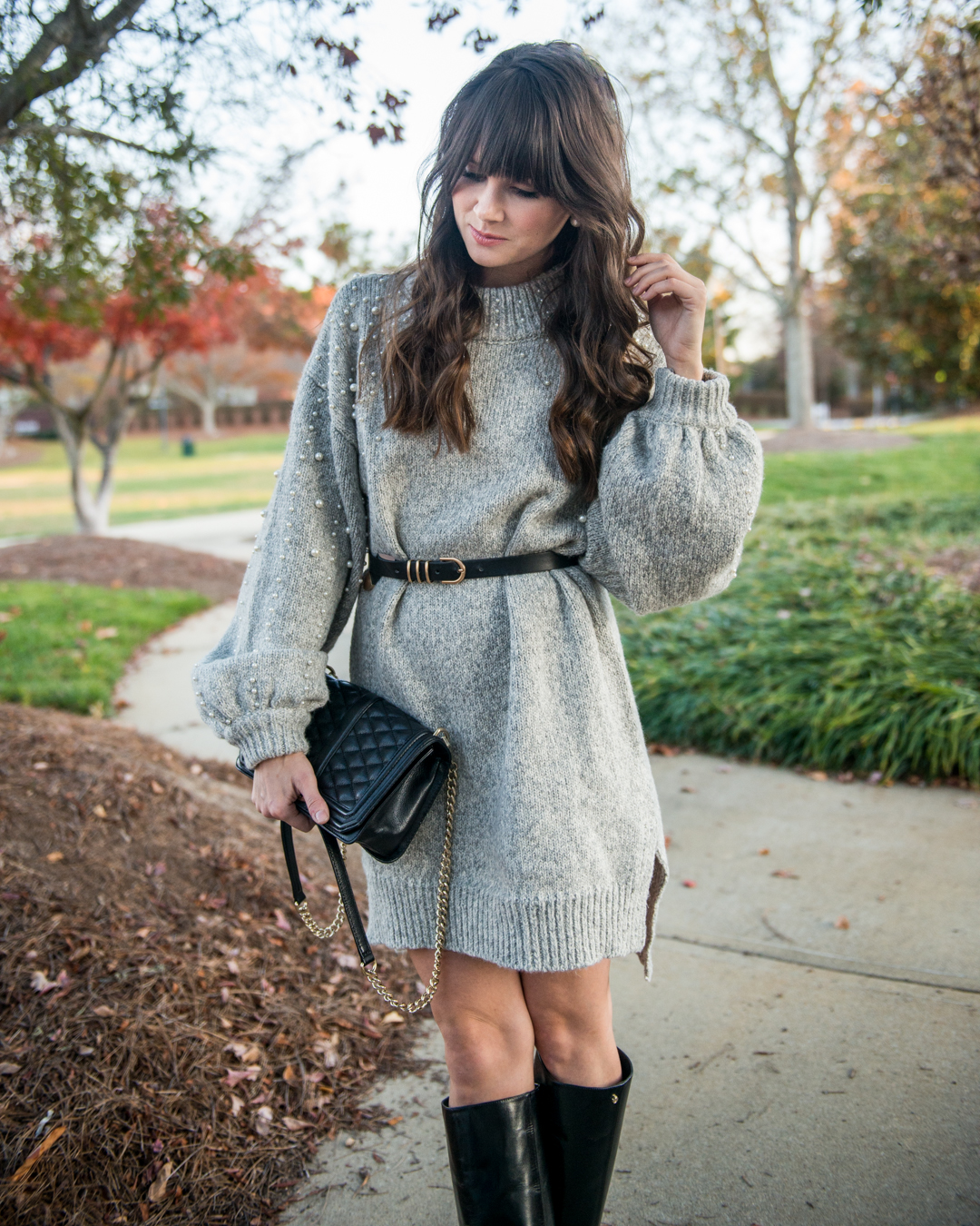 posing with Rebecca Minkoff black leather crossbody