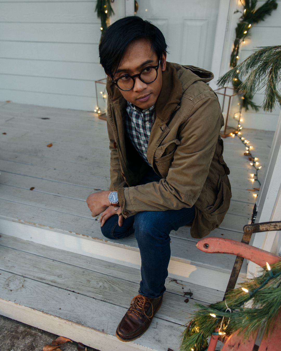male wearing fossil watch and flannel shirt 