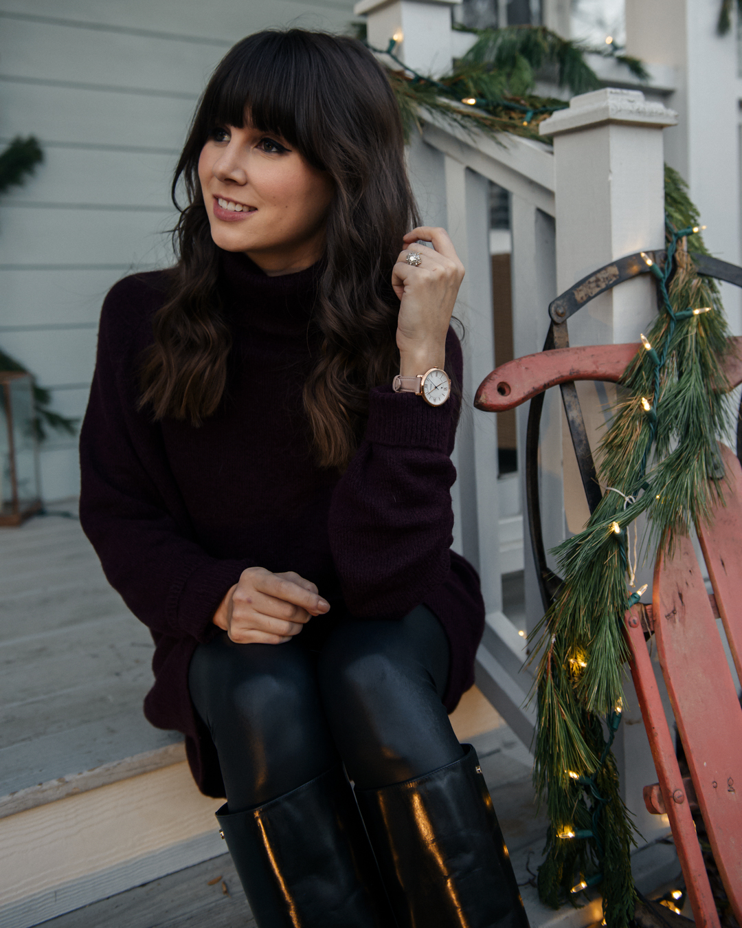 girl showing winter fashions and fossil watch